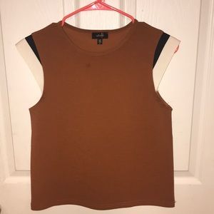 Boutique top with off white and black sleeves